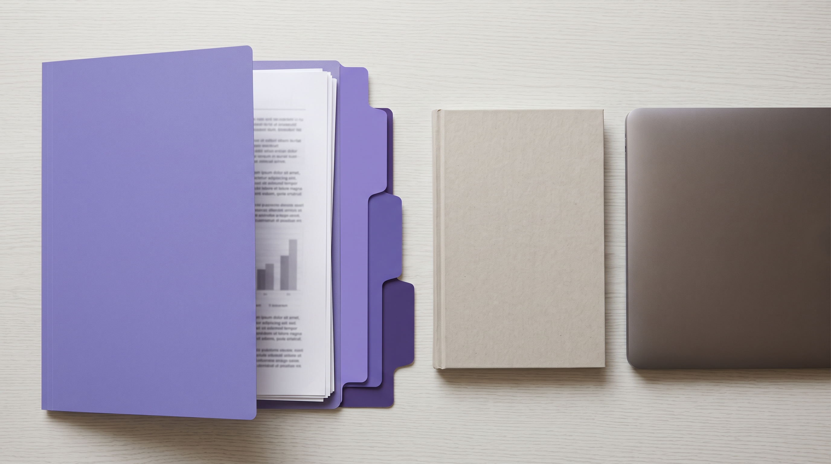 A flat lay of a short report in a purple folder, a plain notebook, and a closed laptop